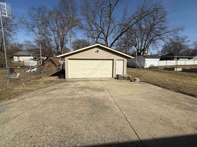 detached garage with fence