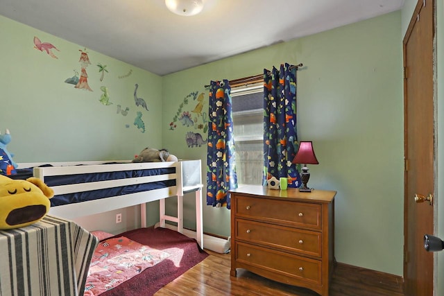 bedroom with wood finished floors