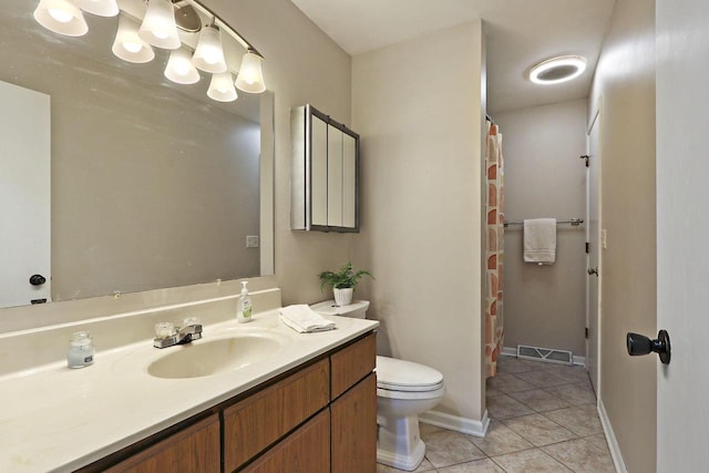 full bath featuring vanity, visible vents, baseboards, tile patterned flooring, and toilet