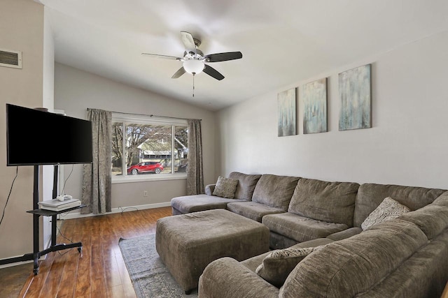 living room with visible vents, a ceiling fan, hardwood / wood-style flooring, baseboards, and lofted ceiling