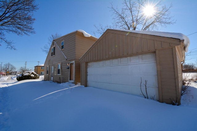 view of front of home featuring board and batten siding and an attached garage