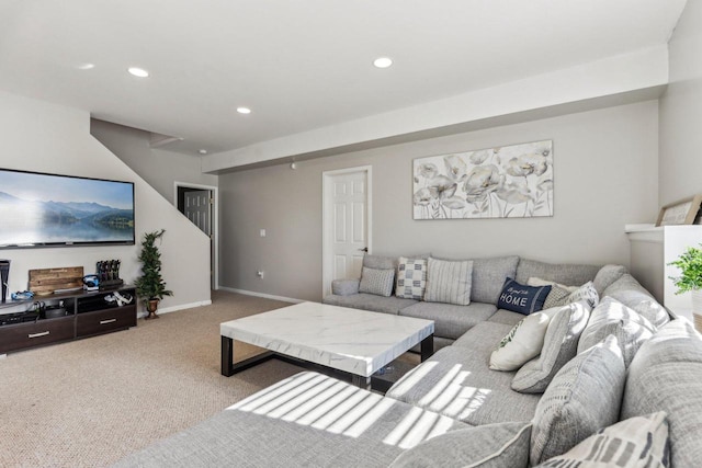 living room featuring recessed lighting, baseboards, and carpet