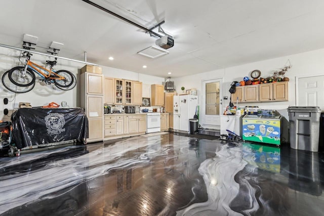 garage with recessed lighting, a garage door opener, and white fridge with ice dispenser