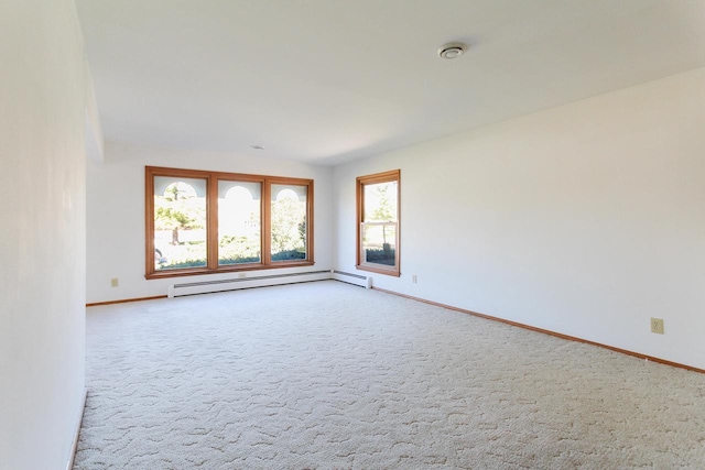 carpeted empty room with baseboards and baseboard heating