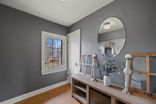 interior space featuring wood finished floors and baseboards