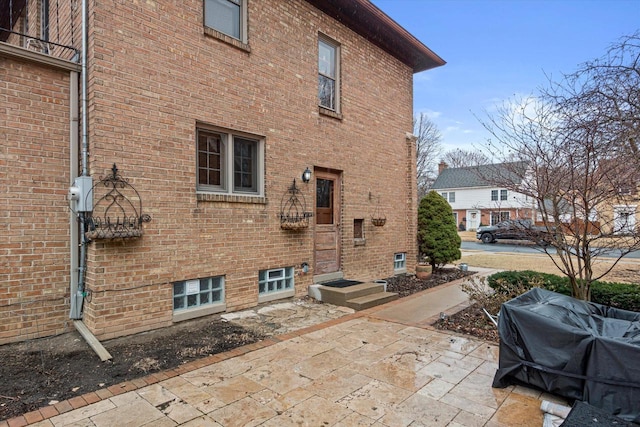 exterior space featuring brick siding