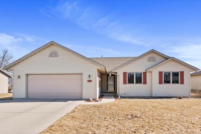 ranch-style home featuring a garage and driveway