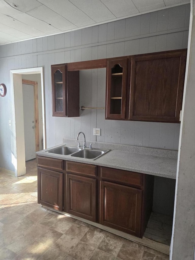 1638 Taylor Ave, Racine, WI 53403 - kitchen with light countertops, glass insert cabinets, and a sink