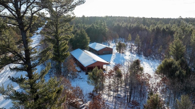 birds eye view of property featuring a view of trees