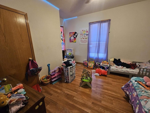 bedroom with wood finished floors