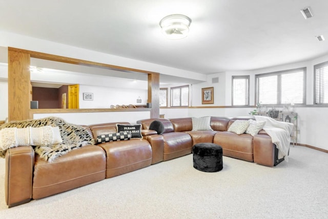 living area featuring carpet flooring, baseboards, and visible vents