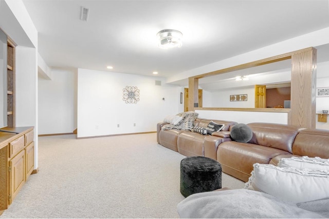 living room with recessed lighting, baseboards, visible vents, and light carpet