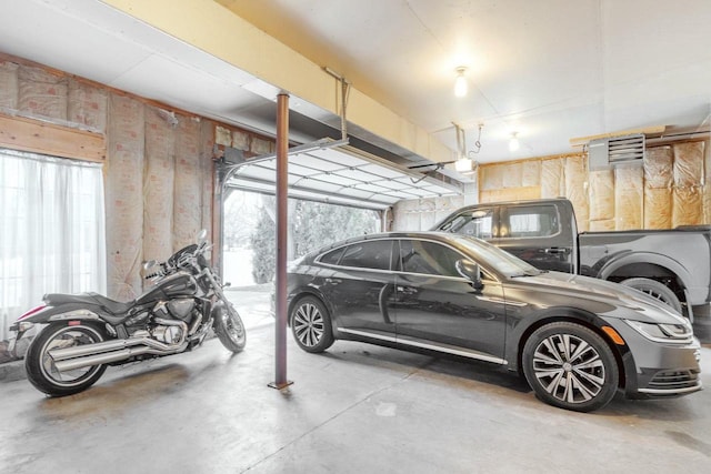 parking garage featuring a garage door opener