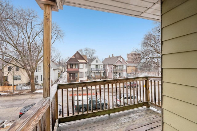 wooden terrace featuring a residential view