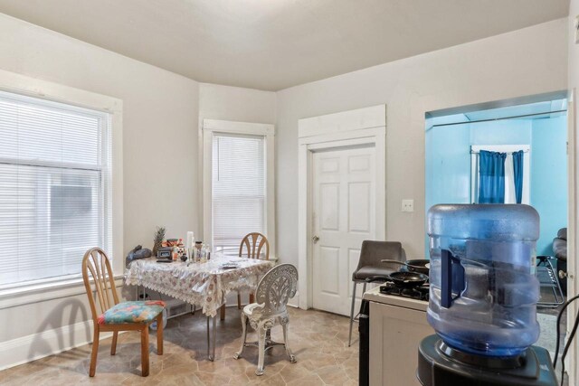 dining area featuring baseboards