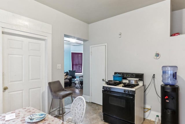 kitchen featuring range with gas cooktop