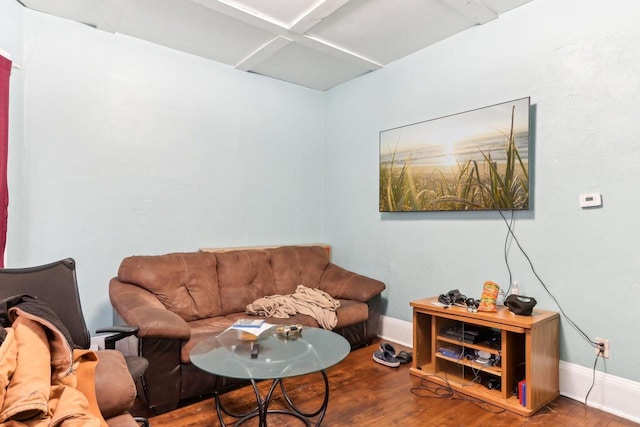 living area featuring wood finished floors and baseboards