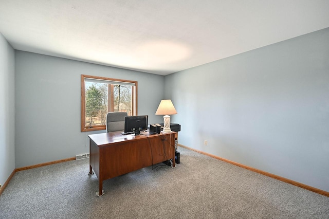 office featuring visible vents, baseboards, and carpet floors