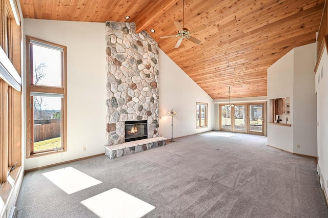 unfurnished living room featuring wooden ceiling, carpet flooring, a fireplace, and high vaulted ceiling