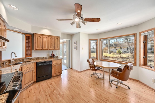 kitchen with a sink, black dishwasher, stainless steel range with electric stovetop, and light wood-style flooring