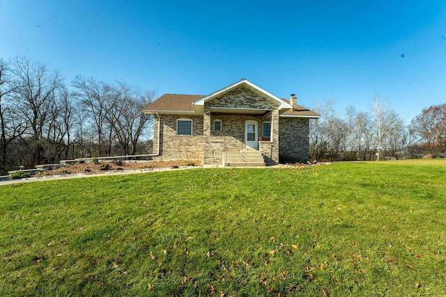 view of front of house featuring a front lawn and a chimney