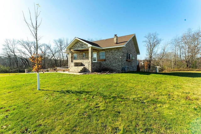 view of property exterior featuring a lawn, stone siding, and a chimney