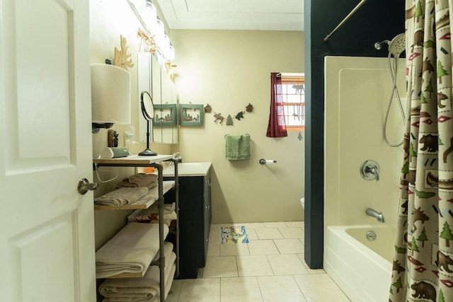 full bathroom featuring shower / bath combo with shower curtain, vanity, and tile patterned flooring