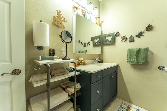 bathroom featuring tile patterned flooring and vanity