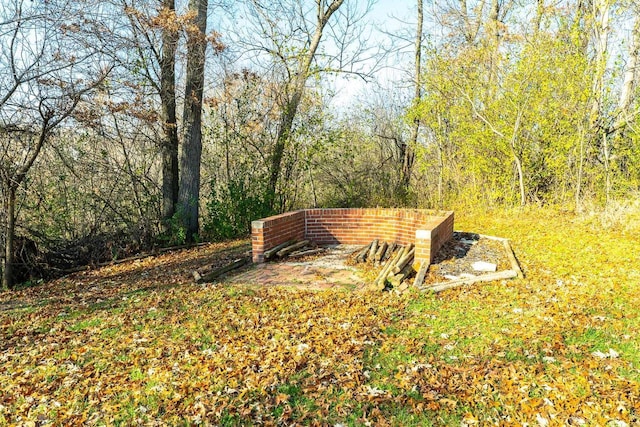 surrounding community featuring a view of trees