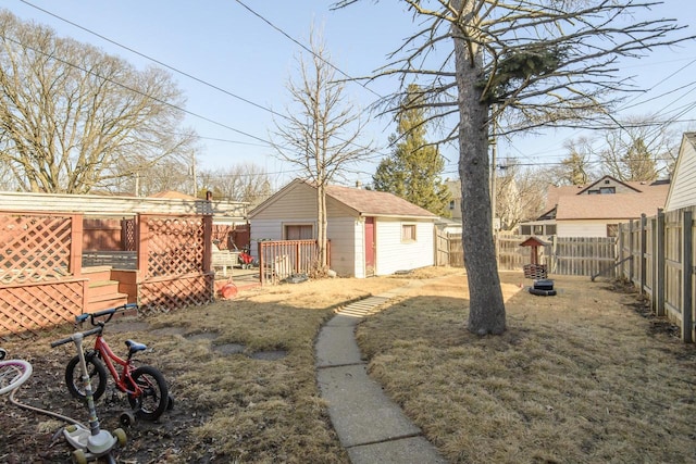 view of yard featuring an outbuilding and a fenced backyard