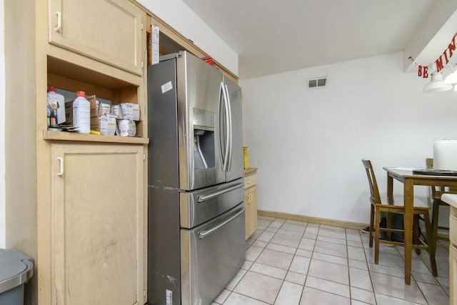 kitchen with visible vents, baseboards, light brown cabinetry, light tile patterned floors, and stainless steel refrigerator with ice dispenser