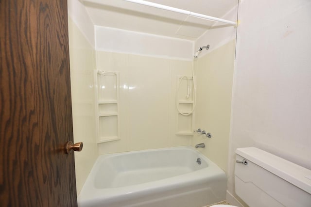 bathroom with tub / shower combination and toilet