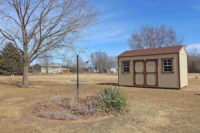 view of yard with a shed and an outdoor structure