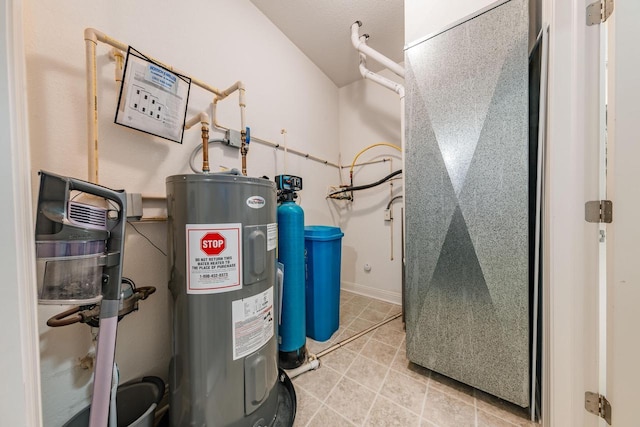 utility room featuring water heater