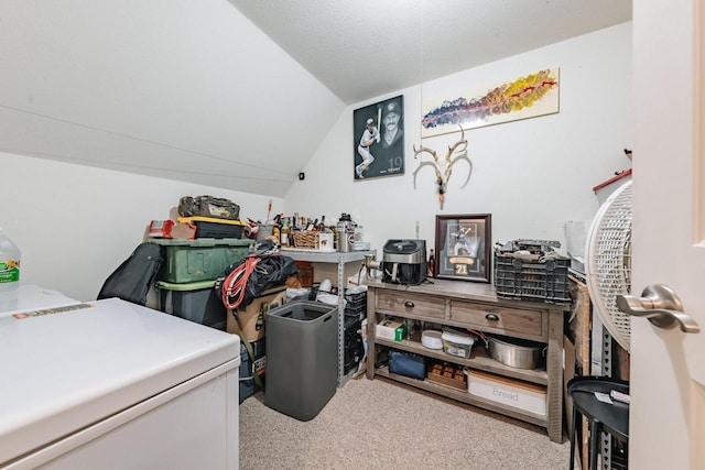 carpeted home office featuring lofted ceiling