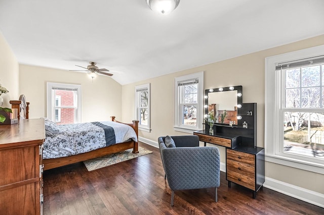 bedroom featuring vaulted ceiling, multiple windows, baseboards, and dark wood-style flooring