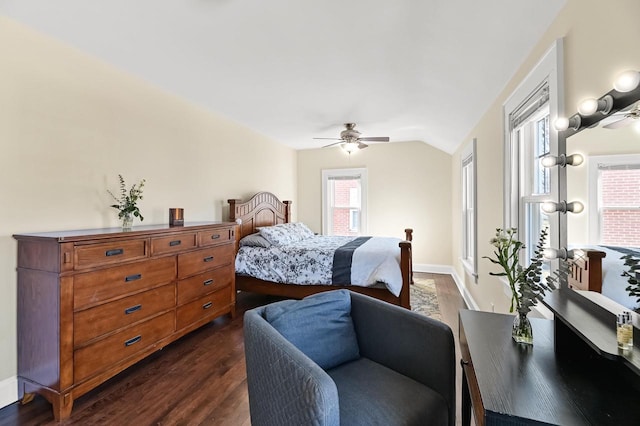 bedroom with vaulted ceiling, dark wood-style floors, baseboards, and ceiling fan