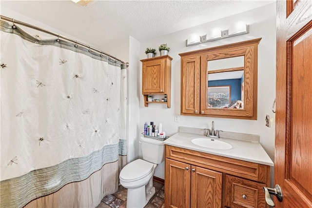 full bathroom with vanity, curtained shower, toilet, and a textured ceiling