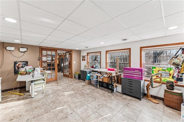 home office with visible vents, a drop ceiling, recessed lighting, french doors, and baseboards