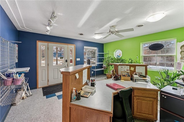 home office featuring a textured ceiling, ceiling fan, and rail lighting