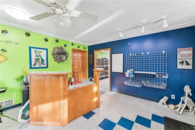 reception area with a ceiling fan