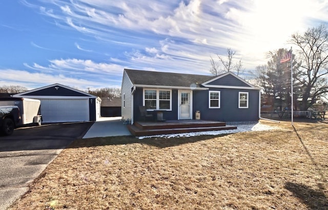 view of front of home with an outbuilding and a garage