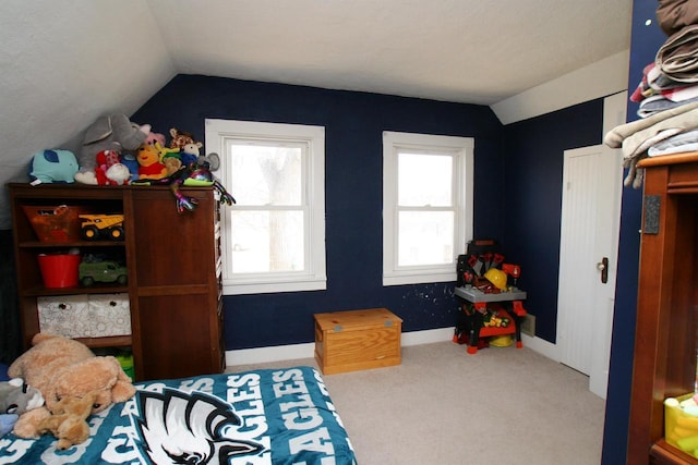 carpeted bedroom with vaulted ceiling