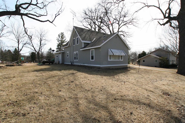 view of home's exterior featuring a yard