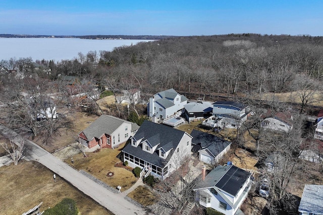 bird's eye view with a residential view and a water view