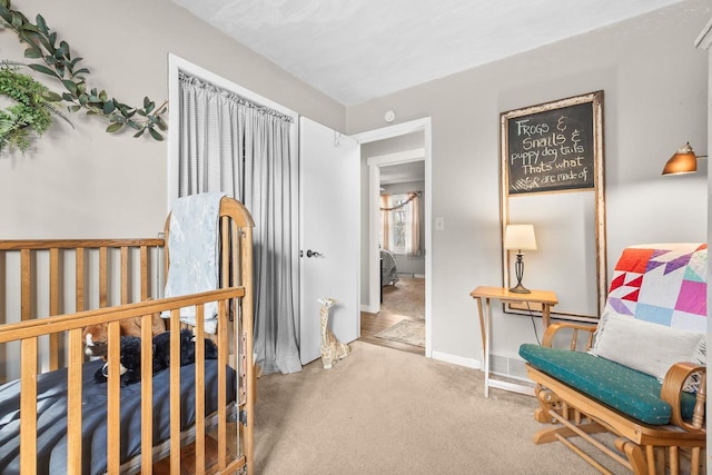 bedroom featuring baseboards and carpet floors