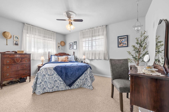 bedroom featuring a ceiling fan and baseboards