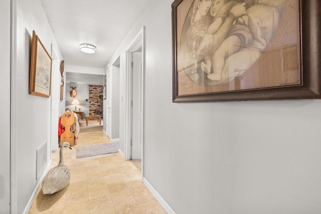 corridor with visible vents and baseboards