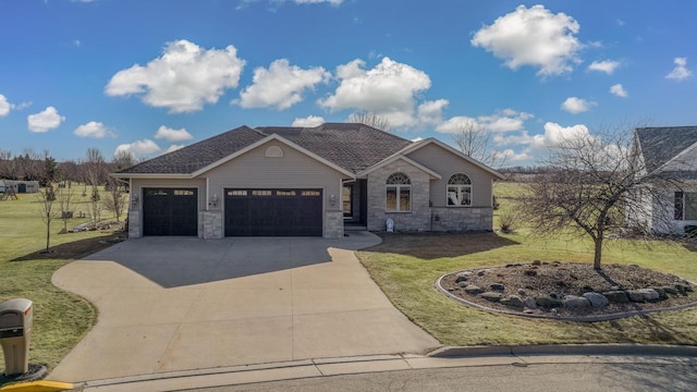 view of front of house with a shingled roof, concrete driveway, a front yard, stone siding, and an attached garage