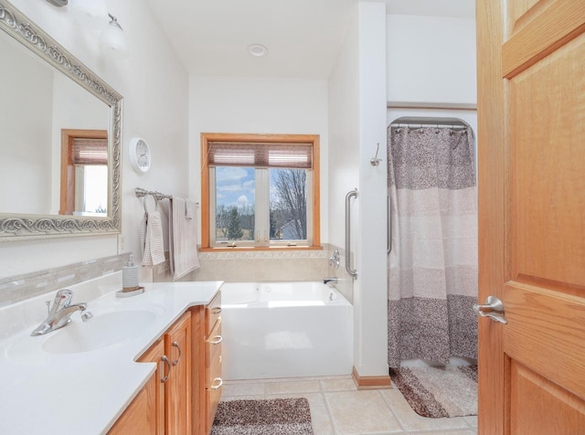 bathroom featuring vanity, a garden tub, curtained shower, and tile patterned floors